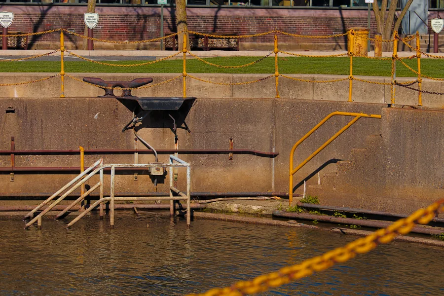 Steps going down to the water at a ship yard dock.